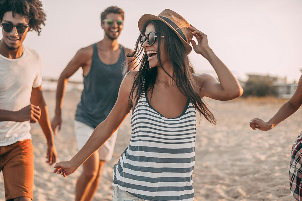 young woman having fun on the beach